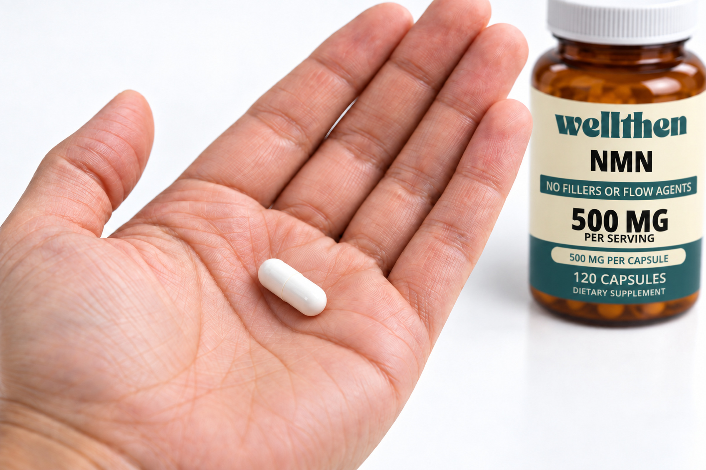 One NMN capsule in a hand beside a finished 120-count bottle